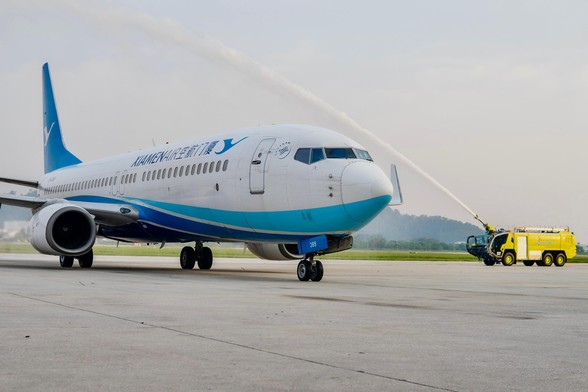 An aircraft getting water salute.