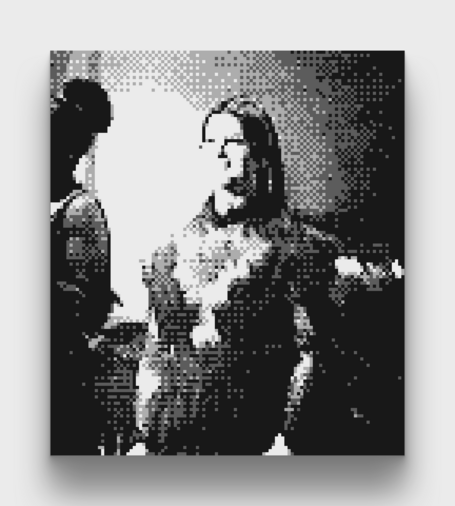 A black and white photo of Lana Del Rey and her backup singers taken with a Gameboy Camera taken at the All Things Go music festival.