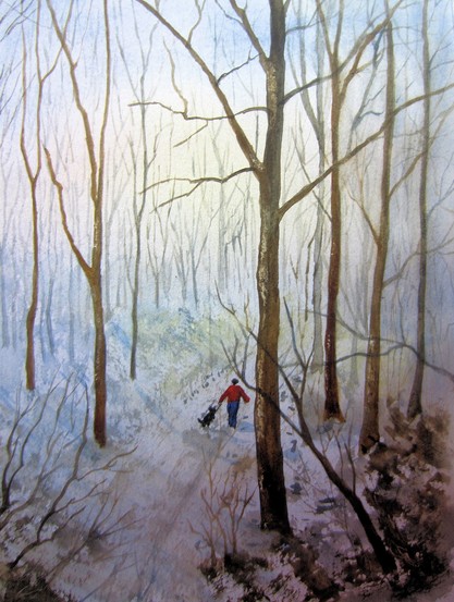 un être humain et son chien marchant dans la neige en foret 