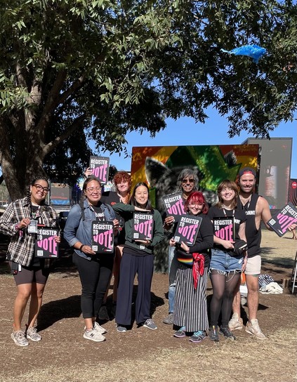 8 headcount volunteers posing with headcount clipboards