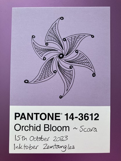 Scara pattern is a six-fold rotational pattern with curved sail-like petals rotating around a central circle 