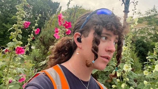 A transfeminine person with long hair