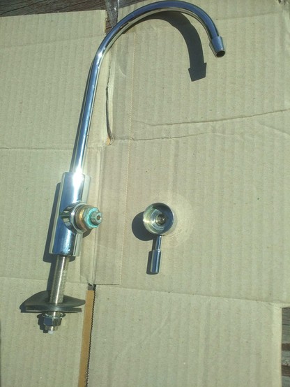 tap with press-fitted handle removed by wedging.
