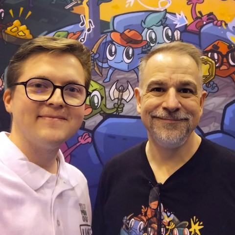 Two handsome gentlemen at the Dice Tower booth at SPIEL Essen
