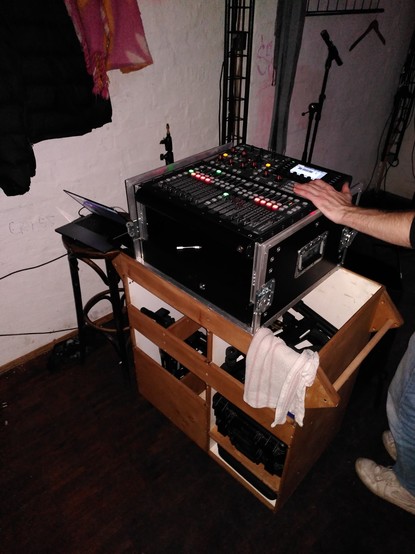 Behringer X32 compact on a mobile shelf with a MacBook left to it to record the show