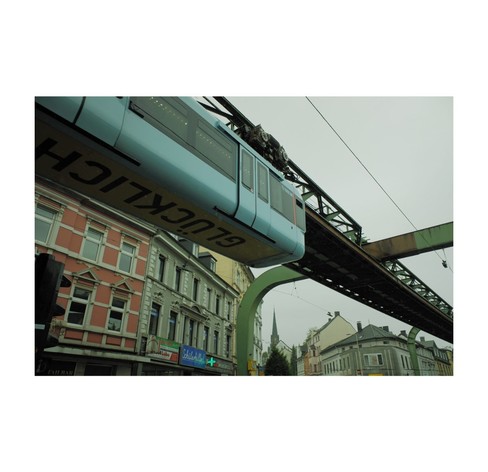 A dangling turquoise monorail.