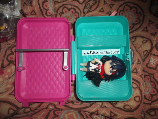 To answer a question, yes, nendoroids can fit in it.

No, it doesn't make a good carrying case with all considered but it's good for other things (like storing nendoroid doll clothes).