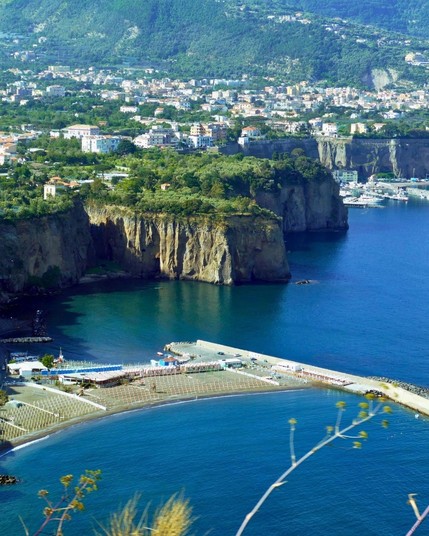 Sorrento, a stunning cliffside town in Campania, Italy, offers breathtaking views of the Bay of Naples and is famous for its lemon groves and limoncello.