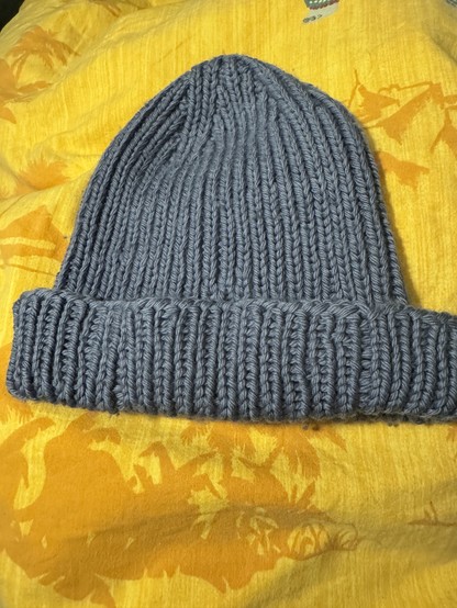 Hat with a brim and mended stitches not visible anymore