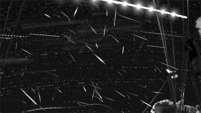 From South facing camera:
Black background with many meteor streaks - mostly short and aligned to different directions. There are also faint arc trails in the background which are the trails of stars.

There is one brighter "transient" running along the top edge of the image. It is obviously a plane as it has a regular bright flashing pattern.