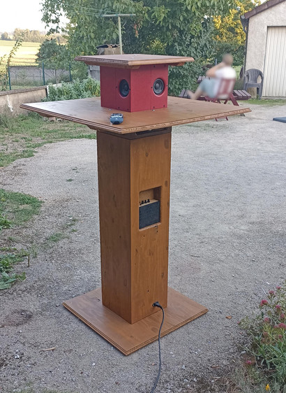 Standing table, stained wood, integrated speakers (top), subwoofer (foot) & amplifier.