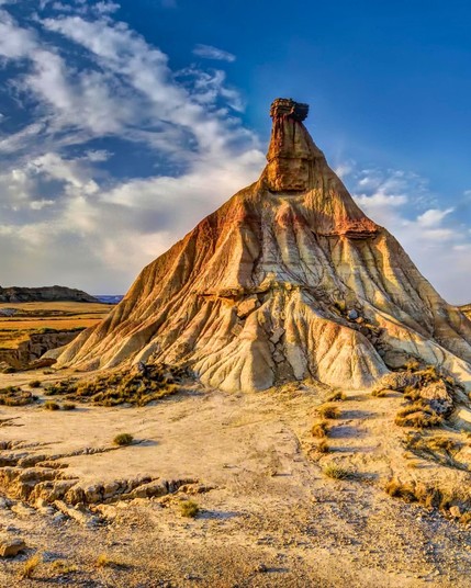 The Bardenas Reales in Spain is a semi-desert natural region characterized by its unique eroded landscapes, often compared to a lunar or Martian terrain.