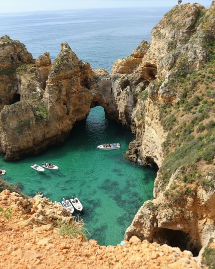 Ponta da Piedade in Portugal's Algarve region is famous for its dramatic cliffs, sea caves, and crystal-clear waters, making it a picturesque spot for coastal exploration.