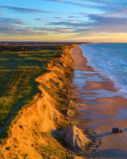 The North Jutland Cliff in Denmark is a dramatic coastal feature known for its towering limestone cliffs, offering stunning views of the North Sea.