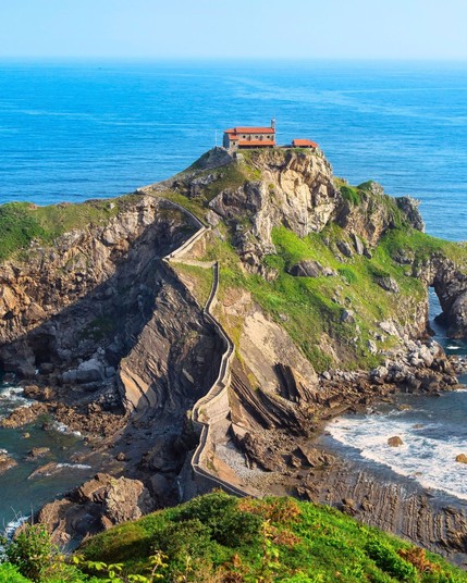 San Juan de Gaztelugatxe is a stunning islet in Spain's Basque Country, home to a picturesque hermitage atop 241 stone steps