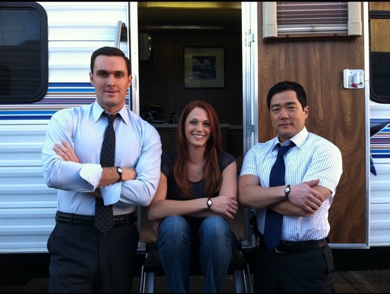 Owain Yeoman, Amanda Righetti and Tim Jang of The Mentalist Tv Show, smiling.