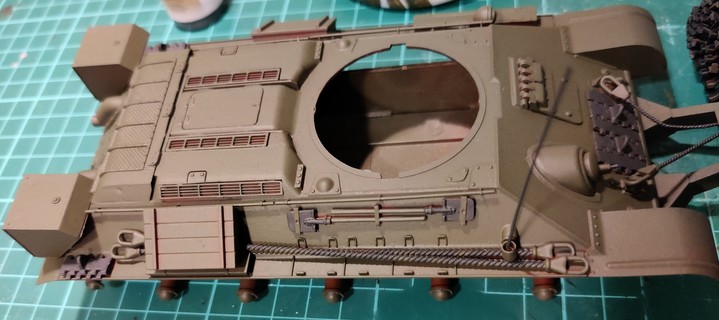 A T-34/76 hull painted Russian Green with the first batch of plain steel -coloured parts in German Grey