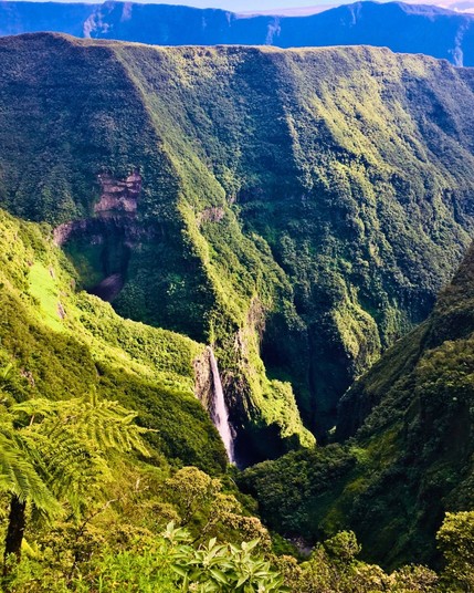 Trou de Fer, located on the island of Réunion, is a breathtaking and remote canyon with lush greenery, waterfalls, and rugged terrain