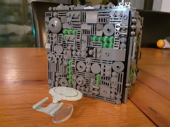 A hastily built LEGO Borg Cube, with a Micromachines USS Enterprise D for scale.
