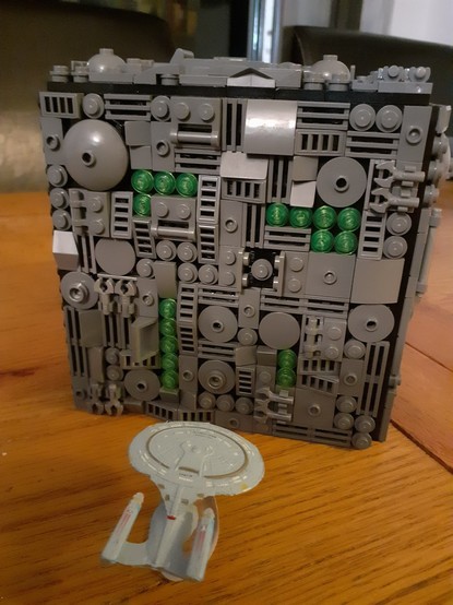 A hastily built LEGO Borg Cube, with a Micromachines USS Enterprise D for scale.