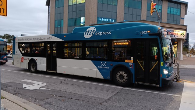 MiWay 1402, which is a New Flyer XD40. The bus has the blue miExpress livery, and the side sign reads "11 TO WESTWOOD",