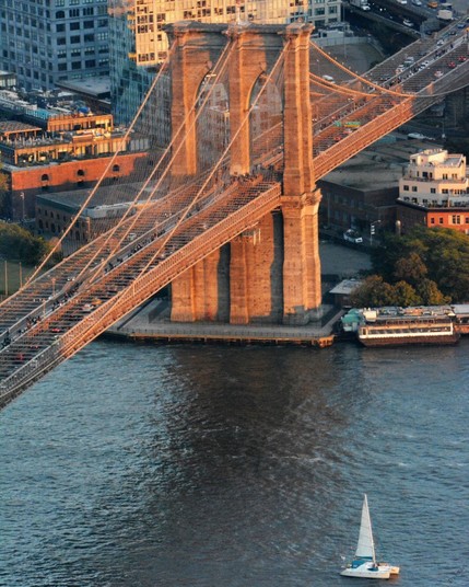 The Brooklyn Bridge is an iconic suspension bridge connecting Manhattan and Brooklyn in New York City, completed in 1883, and known for its architectural significance and scenic views.