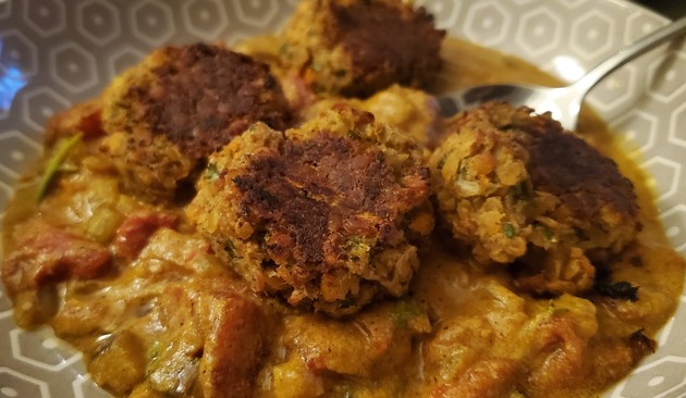 Three lentil balls on a curry