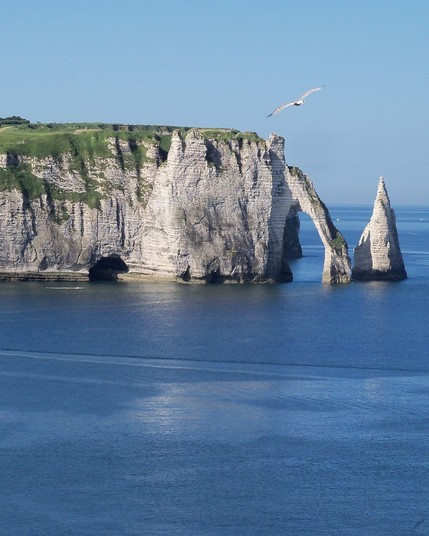 Étretat is a picturesque coastal town located in Normandy, France. It is known for its stunning white chalk cliffs, natural arches, and pebble beaches, making it a popular tourist destination.