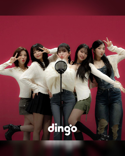 promo poster for the upcoming performance of red velvet on dingo's killing voice.
photo shows a group shot of the 5 red velvet members standing in front of a red backdrop, doing cute poses behind a microphone stand.