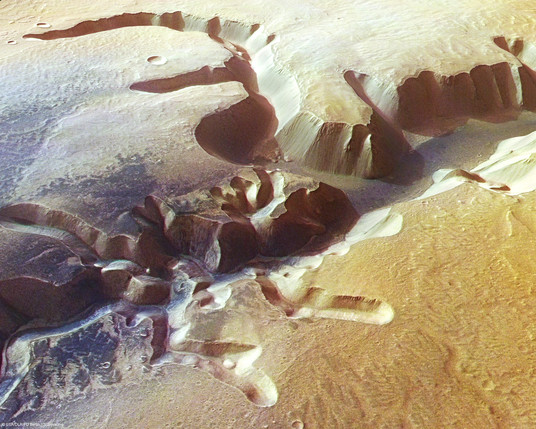 The High-Resolution Stereo Camera (HRSC) on board ESA’s Mars Express has returned images of Echus Chasma, one of the largest water source regions on the Red Planet. Echus Chasma is the source region of Kasei Valles which extends 3000 km to the north. The data was acquired on 25 September 2005. The pictures are centred at about 1° north and 278° east and have a ground resolution of approximately 17 m/pixel.

The dark material shows a network of light-coloured, incised valleys that look similar to drainage networks known on Earth. It is still debated whether the valleys originate from precipitation, groundwater springs or liquid or magma flows on the surface.

Credits: ESA/DLR/FU Berlin (G. Neukum)