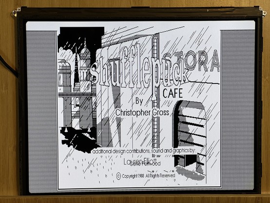 Screenshot of the Shufflepuck Cafe splash screen for Max as 1-bit.