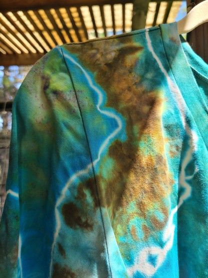 Close up showing a dyed section of turquoise and bronze