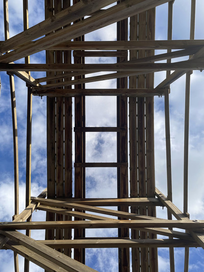 Photo looking up straight up at Mammut wooden coaster track.