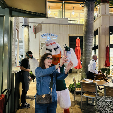 A selfie with Sebastian, University OF Miami, school mascot, and a lady who willingly allowed us to take a picture of her.