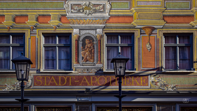 Painted Baroque façade of City Pharmacy (Stadt-Apotheke), Füssen, Allgäu, Bavaria, 11 Nov 2023. Nikon D5600, Nikkor DX 35 mm ƒ1.8G, ISO 100, ƒ4.5, -1 ev, 1/400s