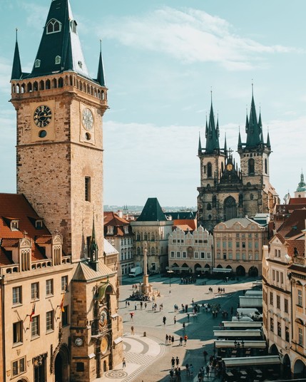 Old Prague town square with Church of our Lady before Tyn, astronomical chimes.