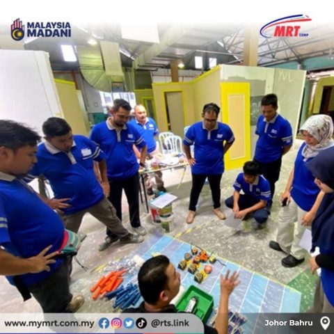 A group of students and an instructor with paint job equipments.