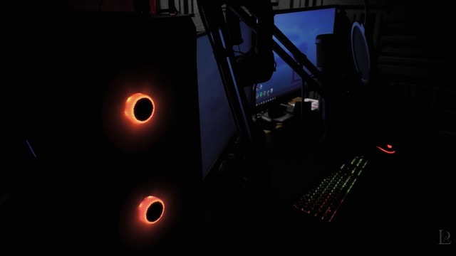 LastofAvari's PC setup, featuring Fractal Design Focus 2 RGB PC case. The fans are glowing orange/red in theme with Razer Cynosa V2 keyboard and Logitech G102 Lightsync mouse.
