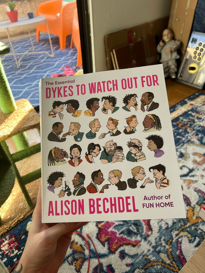 The cover of The Essential Dykes To Watch Out For by Alison Bechdel
With art showing the characters facing each other in sequence as each character is show twice turning to face the next character who continues the sequence.