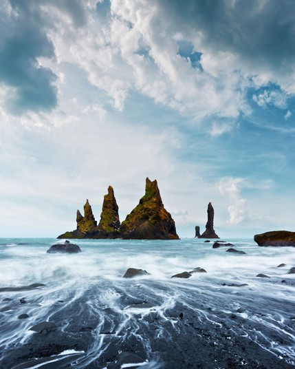 Reynisdrangar (Troll Toes) on black beach, south coast of Iceland