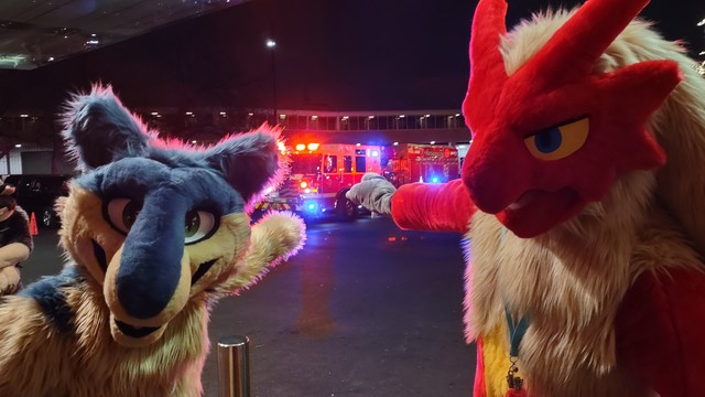 A Blaziken and a Quilava/Typhlosion hybrid excitedly pointing at a fire truck.