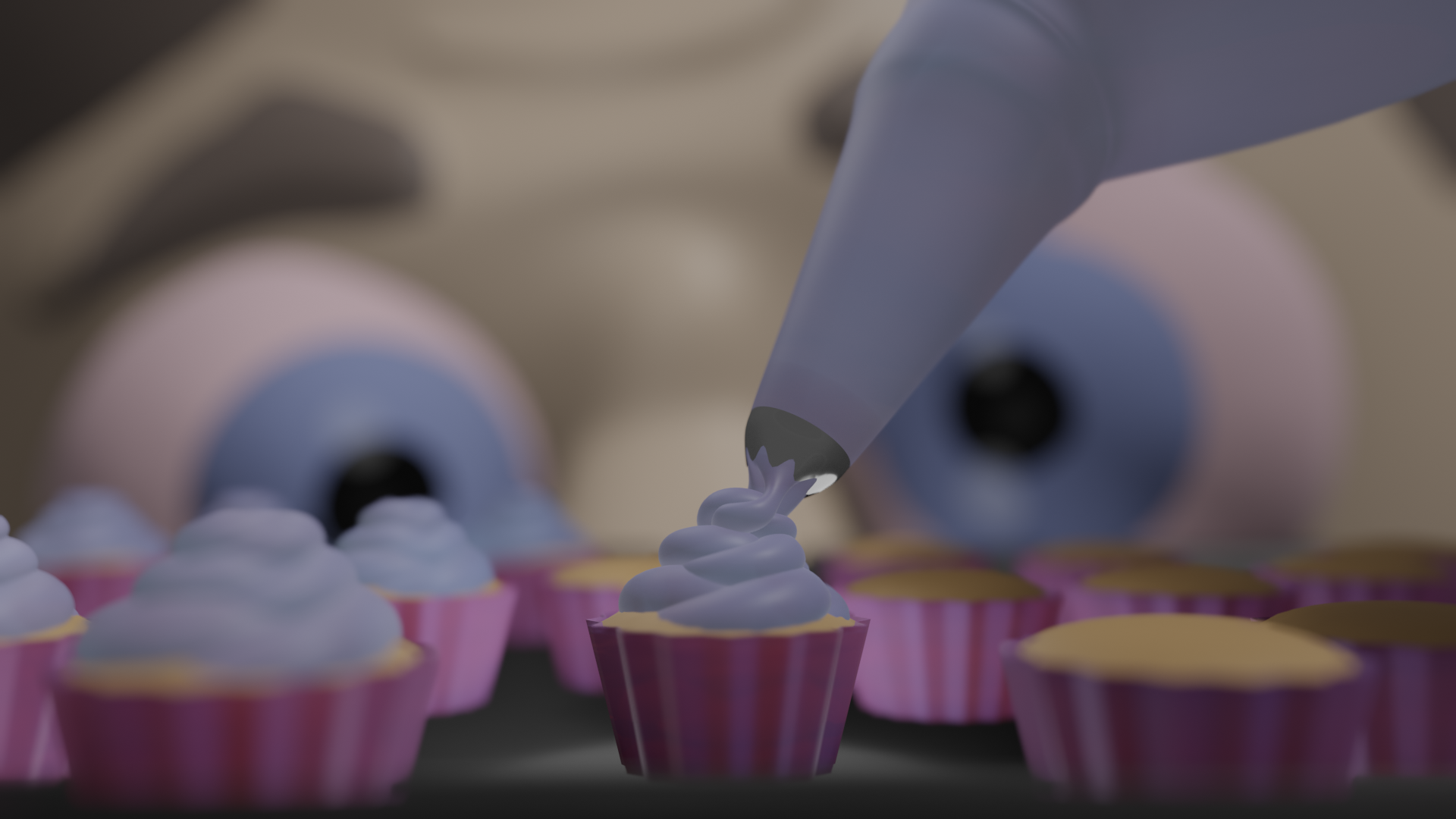 A close up scene of icing being squeezed onto a cupcake with a piping bag on a tray surrounded by iced cupcakes on the left and bare ones on the right. In the background, an out of focus face with an expression of anxious concentration peers across the tray