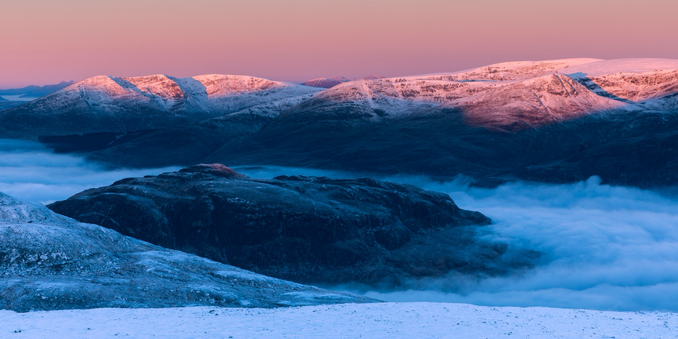 View from the summit of Geal Charn at sunrise with a cloud inversion below