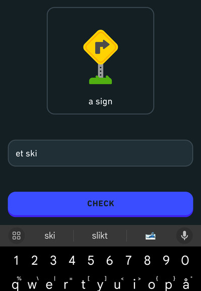 An Android screenshot of a DuoLingo lesson for practicing Norwegian. The lesson is asking to translate the phrase, “a sign.” The text box for the answer contains the partial words, “et skil.”

Below the lesson is a partial view of the on screen keyboard. The primary autocomplete suggestion is “slikt,” and it does not suggest "skilt,” which is the correct answer at all.
