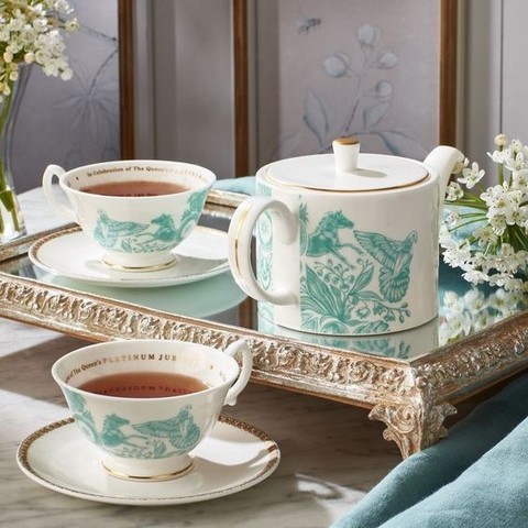 Image shows two teacups and saucers and a teapot in fine china porcelain on a tray. Caption reads: I love tea as much as anyone but this set for two from Fortnum and Mason is £250 - that's a lot of Mcdonalds