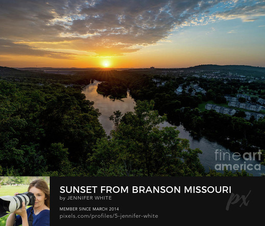 A beautiful sunset from an overlook with an expansive view of Branson, Missouri.