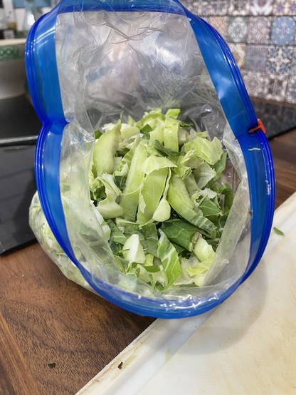 Zip bag full of chopped cauliflower leaves 