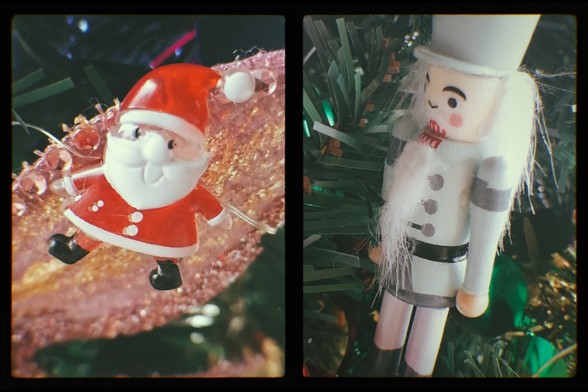 A mock digital half frame. Two vertical pics side by side. Left shows a jaunty small Santa light on a tree with a sparkly winged pink dive wing behind him. The right shows a blue Nutcracker soldier, also on a Xmas tree.