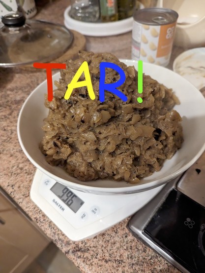 A white bowl on a set of scales reading 996g. The bowl contains browned onions.

There is rainbow comic sans over the top reading TAR!