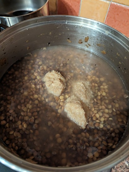 Steel pot with 800g lentils, water and a couple of spoons of ginger paste. 